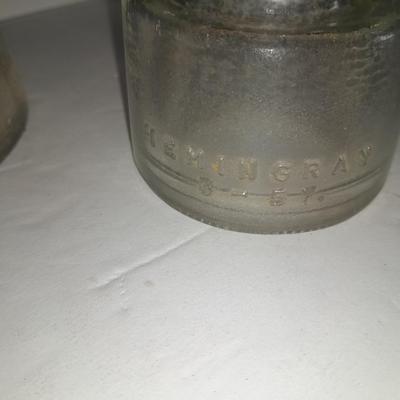 Four clear glass Hemingray Insulators