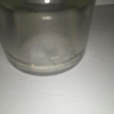 Four clear glass Hemingray Insulators