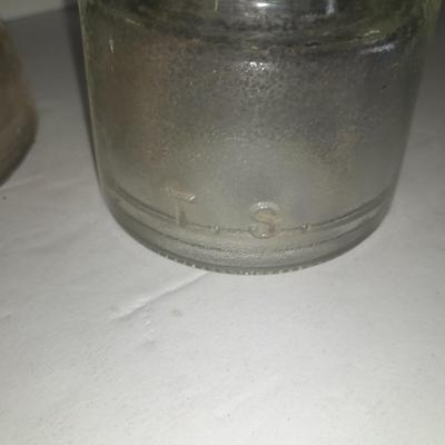 Four clear glass Hemingray Insulators