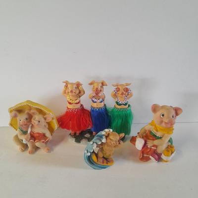 Hear no, See no, Speak no Hula dancer pigs, with other pigs from the beach
