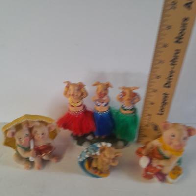 Hear no, See no, Speak no Hula dancer pigs, with other pigs from the beach