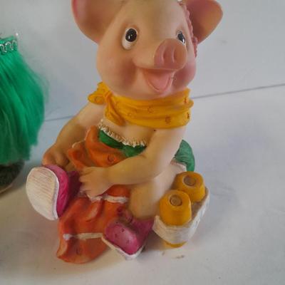 Hear no, See no, Speak no Hula dancer pigs, with other pigs from the beach