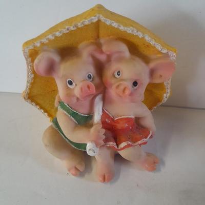 Hear no, See no, Speak no Hula dancer pigs, with other pigs from the beach