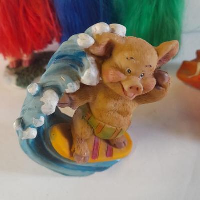 Hear no, See no, Speak no Hula dancer pigs, with other pigs from the beach