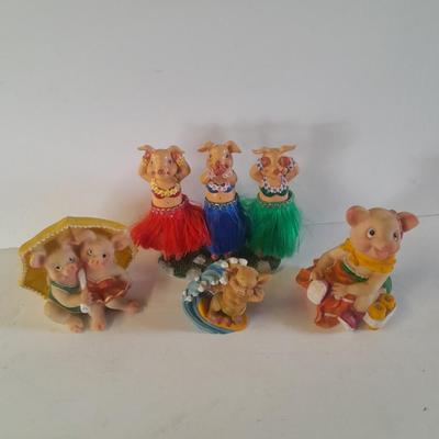Hear no, See no, Speak no Hula dancer pigs, with other pigs from the beach