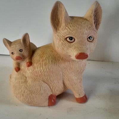 Pigs giving other pigs piggyback rides