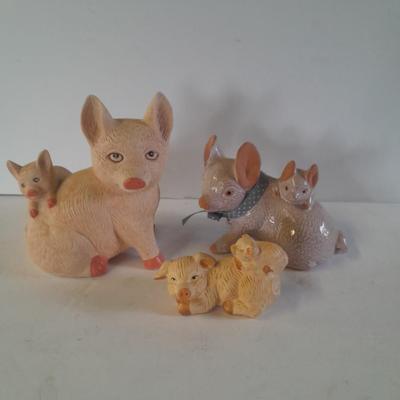Pigs giving other pigs piggyback rides