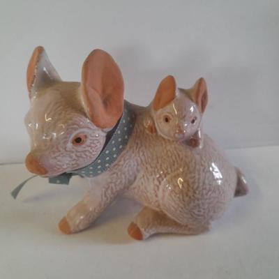 Pigs giving other pigs piggyback rides