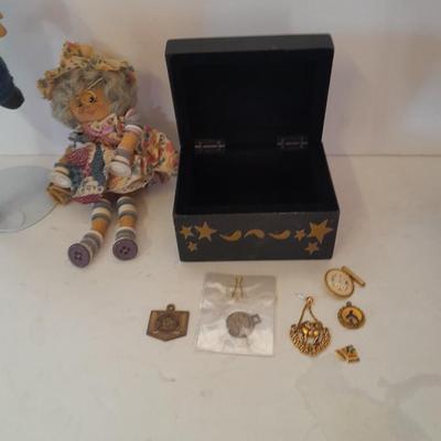 Two collectible dolls with stands, small wooden decorative box and some jewelry