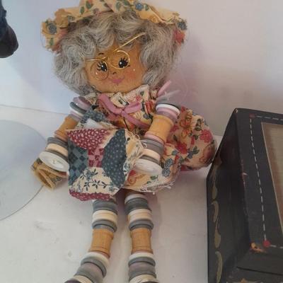 Two collectible dolls with stands, small wooden decorative box and some jewelry