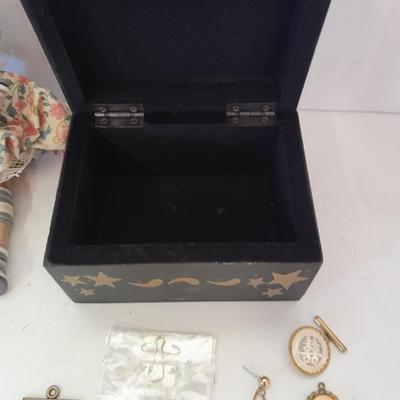Two collectible dolls with stands, small wooden decorative box and some jewelry