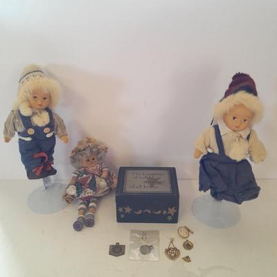 Two collectible dolls with stands, small wooden decorative box and some jewelry
