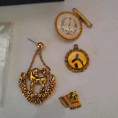 Two collectible dolls with stands, small wooden decorative box and some jewelry