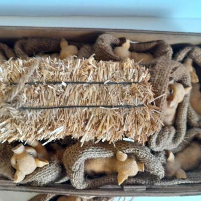 A dozen little pigs in blankets, in a wooden box