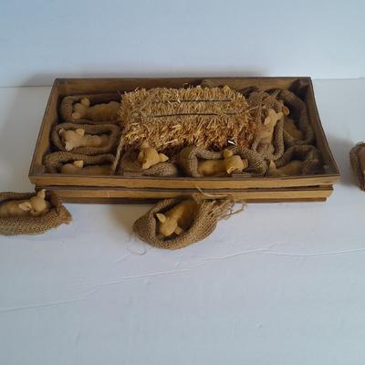 A dozen little pigs in blankets, in a wooden box