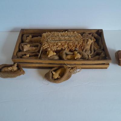A dozen little pigs in blankets, in a wooden box