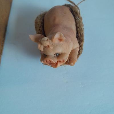 A dozen little pigs in blankets, in a wooden box
