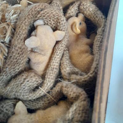 A dozen little pigs in blankets, in a wooden box