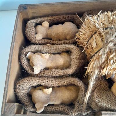A dozen little pigs in blankets, in a wooden box