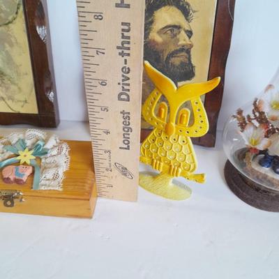 Two vintage Jesus wall hangings, metal Owl earring holder, and other decorative items