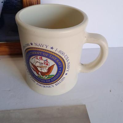 U.S.A. Navy clock and mug with sticker and black and white photograph of a ship