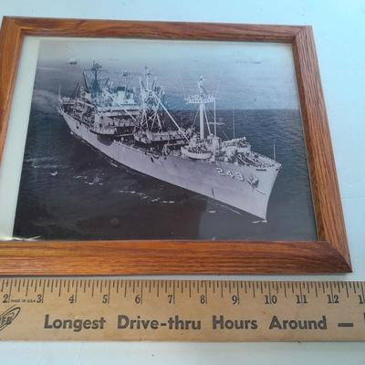 U.S.A. Navy clock and mug with sticker and black and white photograph of a ship