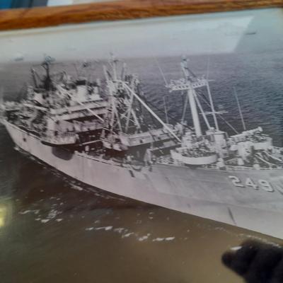 U.S.A. Navy clock and mug with sticker and black and white photograph of a ship