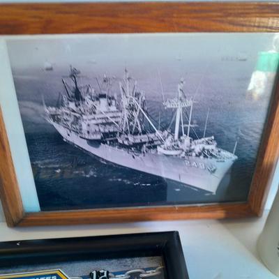 U.S.A. Navy clock and mug with sticker and black and white photograph of a ship