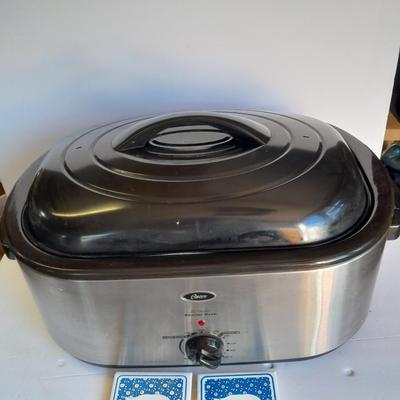 Oster 22 -Quart Electric Roaster Oven with small tile Pig Trivets