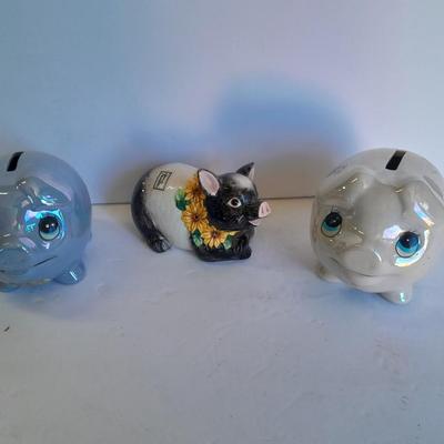 Two piggy banks with a Fits and Floyd sunflower potpourri pig