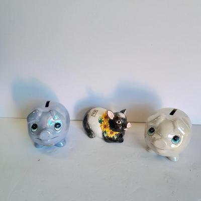 Two piggy banks with a Fits and Floyd sunflower potpourri pig