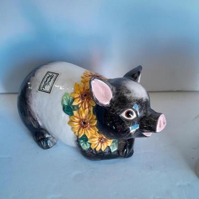 Two piggy banks with a Fits and Floyd sunflower potpourri pig