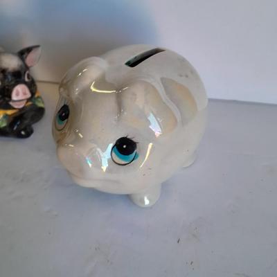 Two piggy banks with a Fits and Floyd sunflower potpourri pig