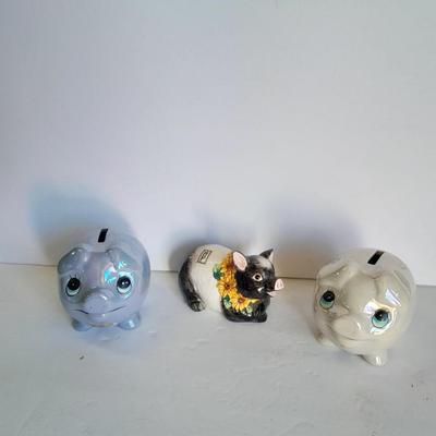Two piggy banks with a Fits and Floyd sunflower potpourri pig