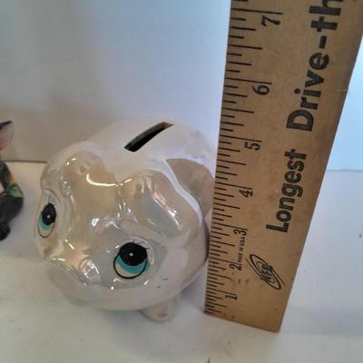 Two piggy banks with a Fits and Floyd sunflower potpourri pig