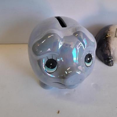 Two piggy banks with a Fits and Floyd sunflower potpourri pig