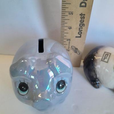 Two piggy banks with a Fits and Floyd sunflower potpourri pig