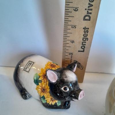 Two piggy banks with a Fits and Floyd sunflower potpourri pig