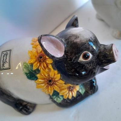 Two piggy banks with a Fits and Floyd sunflower potpourri pig