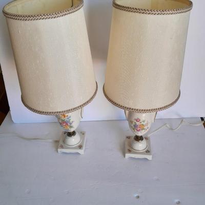 Two floral patterned porcelain lamps with shades