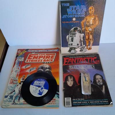 Star Wars collectibles, Nintendo game storybook, 45 LP record, figure, and comics