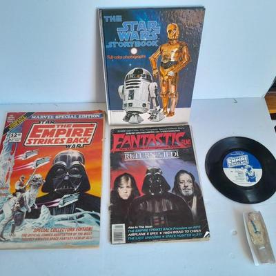 Star Wars collectibles, Nintendo game storybook, 45 LP record, figure, and comics