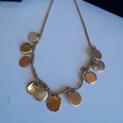 Three fashion necklaces and a gold-colored metal bracelet