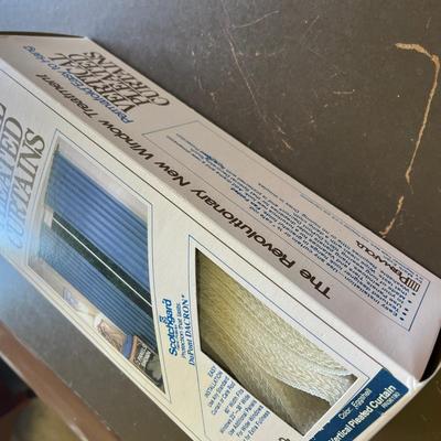2 Boxes of white Verticle curtains