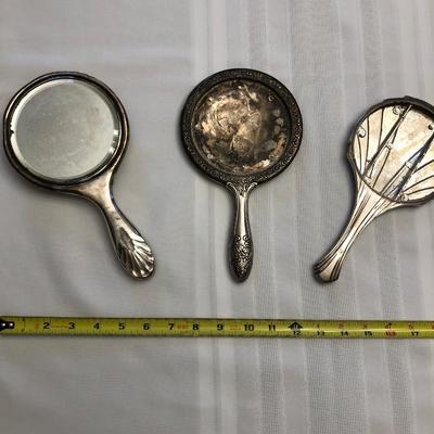 Three hand mirrors