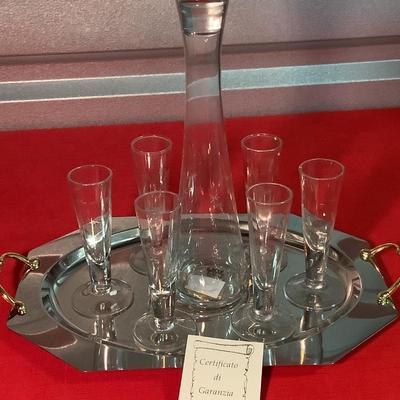 Tag Ltd Decanter with 6 cordial starburst etched glasses on a metal 2 tone silver tray with gold handles