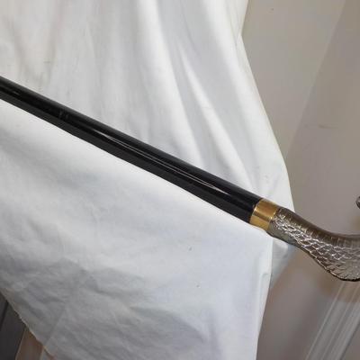 Walking Cobra cane with a large lettler opener.est $75 to $150.