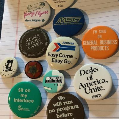 12 buttons/pins of products, Urban Outfitters,  Amtrak, Sit on my interface, Blue Family Jeans