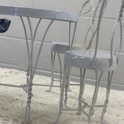 Small Porcelain Doll w/white metal table and 3 chairs