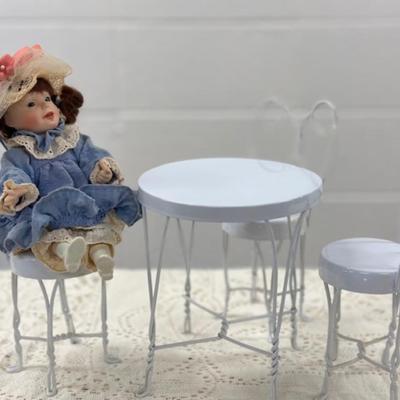 Small Porcelain Doll w/white metal table and 3 chairs
